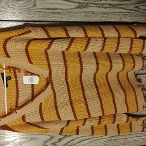 0range striped sweater, frayed at ends